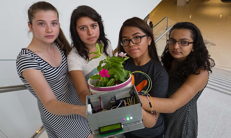 Alyssa Berman, Sara Berrios, Stephanie Villanueva and India Bhalla-Ladd, show off their project, Plantech during a Girls Who Code summer school.jpg