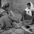 Palestinian women grinding coffee beans