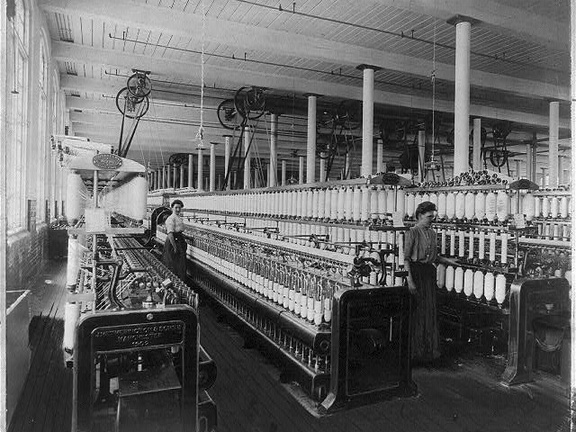 Textile factory with two women at machines LCCN2004674560