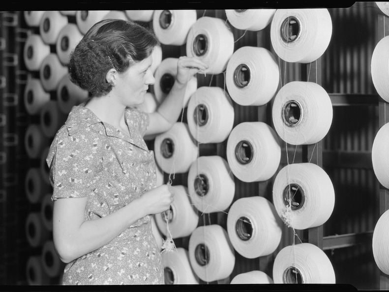 Millville, New Jersey - Textiles. Millville Manufacturing Co. (Woman standing at large spools of thread.) - NARA - 518675