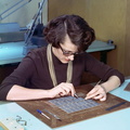 An unknown woman stringing the wiring components of the Apollo Guidance Computer memory..jpg